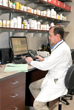 Image of the vet at his computer